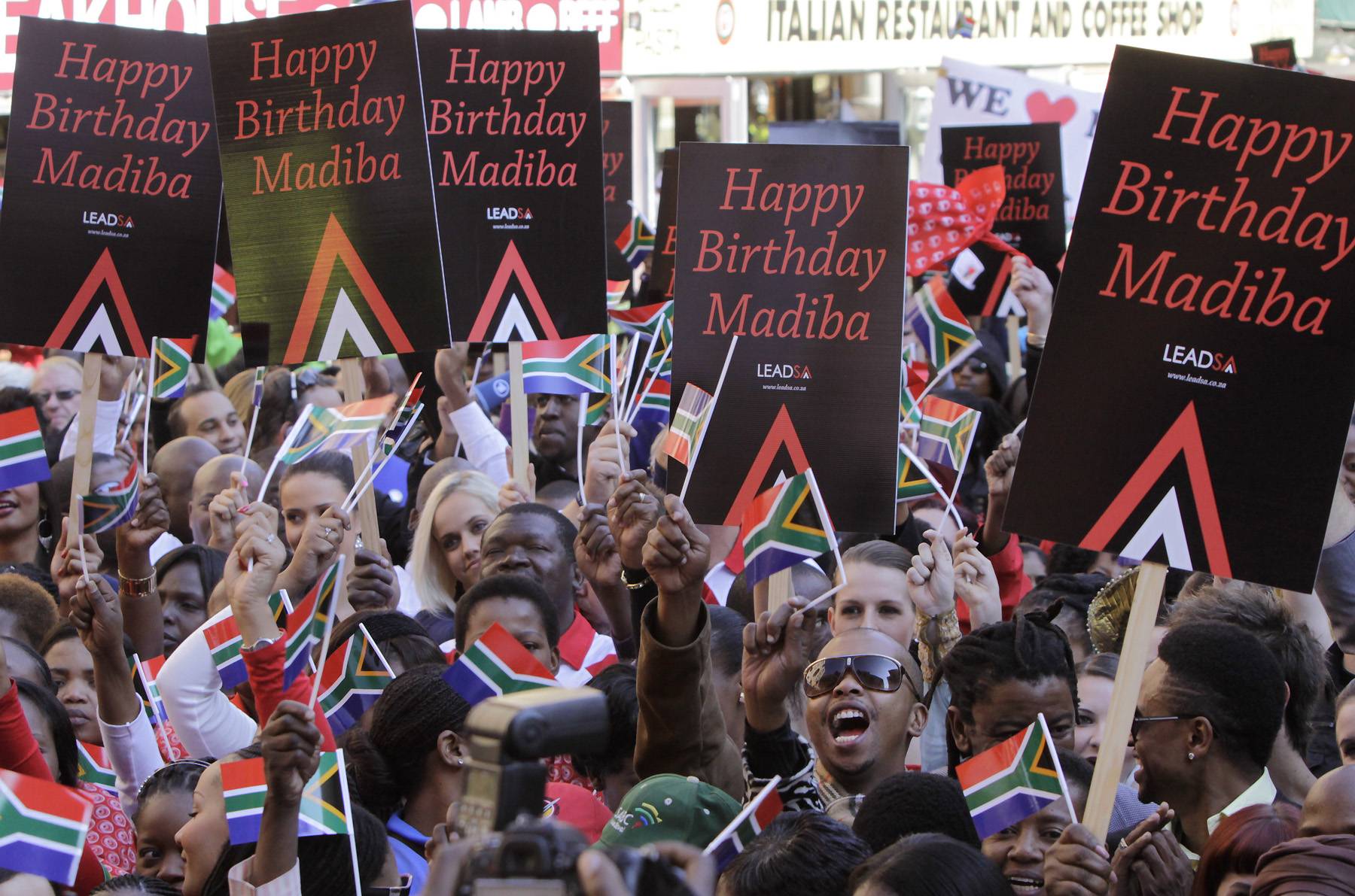 Happy Birthday, Mr. Mandela - On Monday, South Africans gathered to sing &quot;Happy Birthday&quot; to former President Nelson Mandela. Mandela’s office released a video of the sing-a-along in efforts to motivate people around the world to celebrate the revered political leader’s 94th birthday on July 18.&nbsp;(Photo: AP Photo/Denis Farrell)