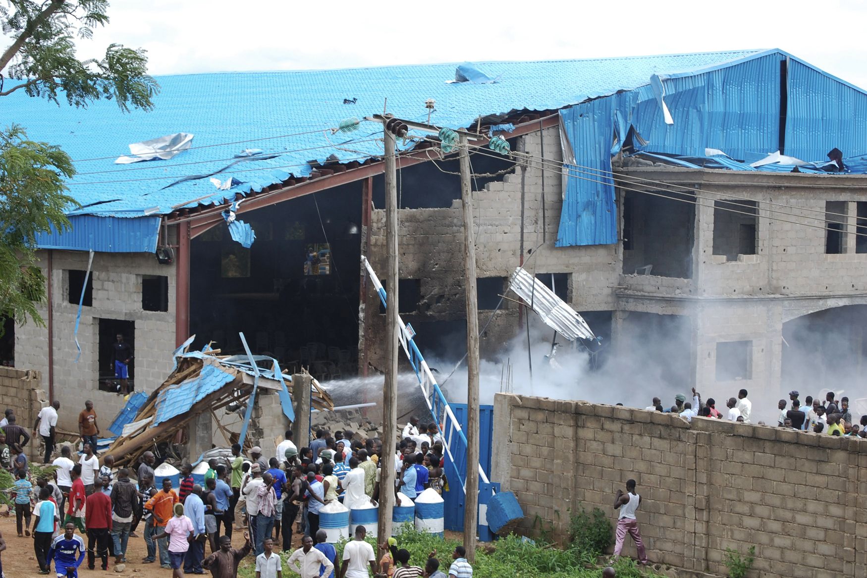 Death Toll Hits 98 in Nigeria Church Bombings - Adidas scraps shackle sneakers, death toll continues in Nigeria church bombings, Southern Christian Leadership Conference supports Atlanta pastor accused of attacking his 15-year-old daughter, plus more. —Britt MiddletonThe terrorist Muslim sect Boko Haram claimed responsibility for Sunday’s three church bombings in northern Nigeria, one in Zaria and another in Kaduna. Officials reported Wednesday that 98 people had died. (Photo: REUTERS/Stringer)