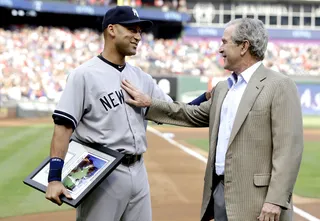 Jeter Honored by President Bush in Texas - The Texas Rangers pulled out all the stops in honoring Derek Jeter on Wednesday night in Arlington. Former President George W. Bush&nbsp;walked onto the field and presented Jeter with an autographed photo of himself and the New York Yankees shortstop from the 2001 World Series. Jeter also received a pair of cowboy boots with the Yankees logo and his No. 2 on them.&nbsp;(Photo: LM Otero/AP Photo)