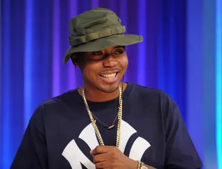 Nas\r - Nas said he wore this throwback outfit because he's in a '90s state of mind.\r\r(Photo by Brad Barket/PictureGroup)