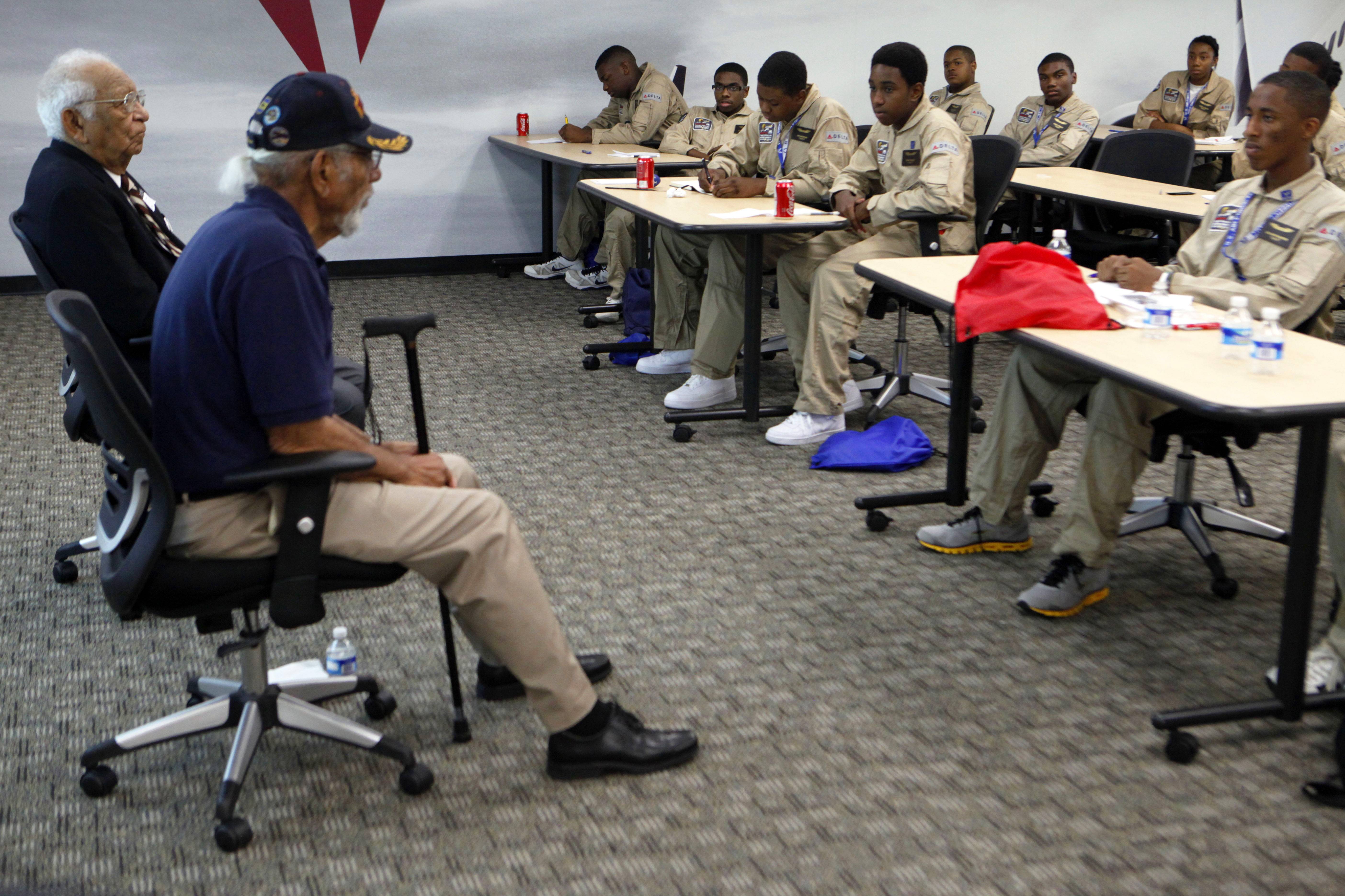 Tuskegee Airmen Help New Generation of Flyers&nbsp; - George Zimmerman’s defense lawyer opens trial with a knock-knock joke, thousands gather in Detroit to honor&nbsp;Martin Luther King Jr.’s march in Detroit in 1963, plus more.&nbsp;&nbsp;— Natelege Whaley and LaToya Bowlah   The Tuskegee Airmen recently passed down their wisdom to high school students interested in flying. Twenty-nine Atlanta students participated in an inaugural week-long aviation course with Tuskegee Airmen Val Archer, 84, and Wilbur Mason, 88.&nbsp;(Photo: Jaime Henry-White/AP)