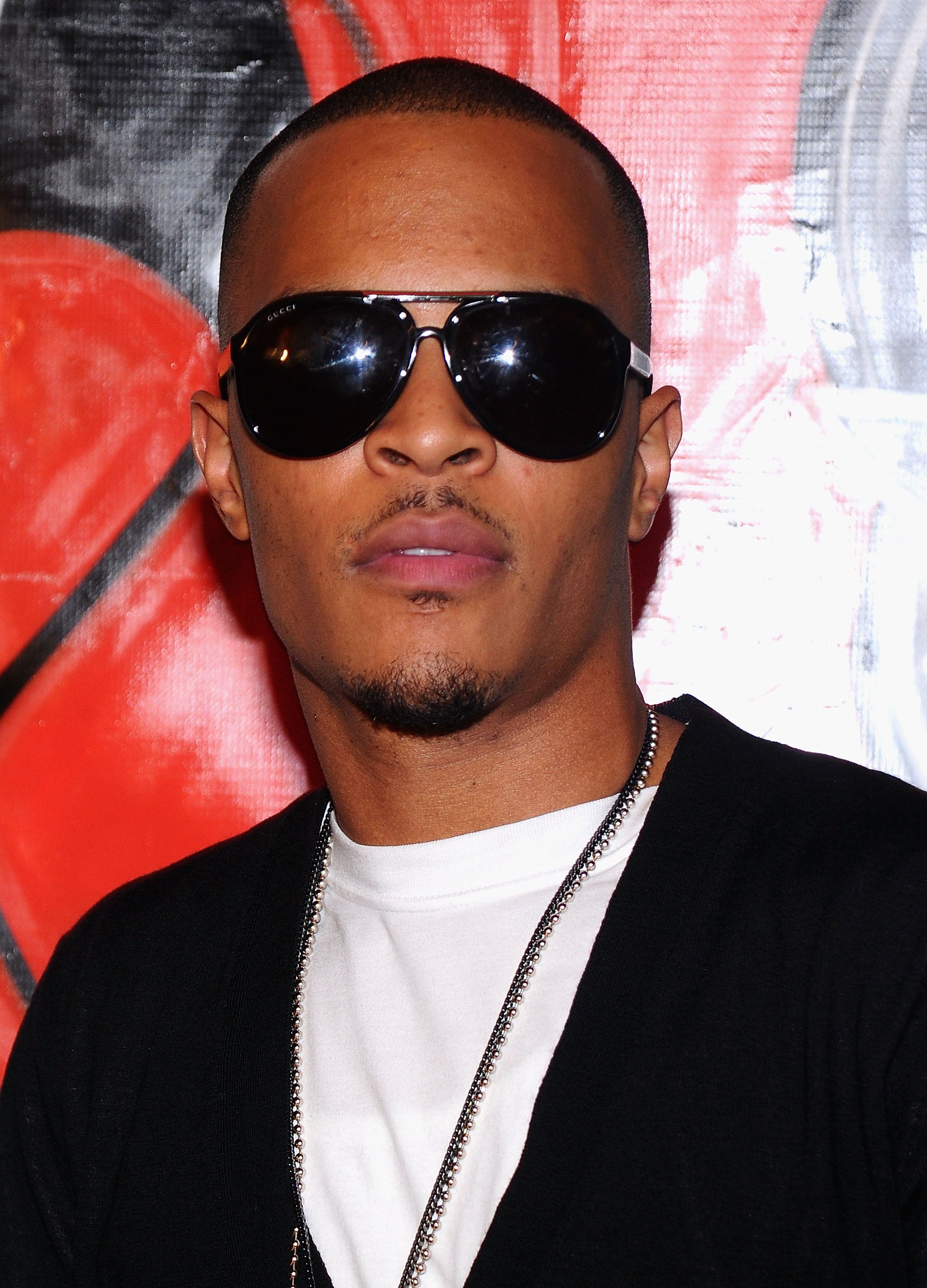 T.I.\r - Following a seven-month prison stint for a felony gun charge, a very-much-still-on-probation T.I. was arrested in Los Angeles along with his wife, Tameka "Tiny" Cottle, on charges of felony possession of a controlled substance on September 1, 2010. The couple was initially pulled over after making an illegal U-Turn however, after smelling marijuana in the car, police conducted a search which resulted in the discovery of an unspecified amount of ecstasy pills. Being in direct violation of his probation, Tip was sentenced to 11 months in jail on October 15, 2010. \r\r(Photo by Jamie McCarthy/Getty Images for AXE)