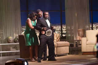 A Heavy Belt To Wear - Co-host Rodney Perry tries on the championship belt. Can he wear it as well as Jones can?(Photo: Darnell Williams/BET)