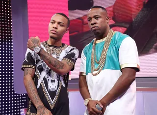 Strong Army - Yo Gotti (R) and host Bow Wow stand firm on the 106 stage. (Photo:&nbsp; Rob Kim/BET/Getty Images for BET)