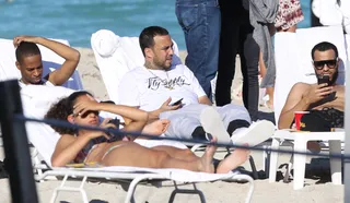 Just Chillin' - Rapper French Montana was spotted taking in some rays on Miami Beach with his crew.(Photo: Splash News)