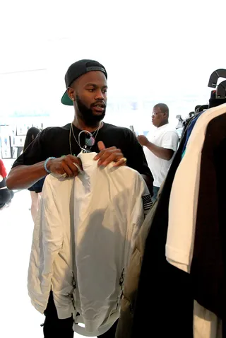 Every Detail Counts - Wardrobe stylists scour through racks of options to find the perfect ensemble to highlight each pair of sneakers debuted at the show. (Photo: Bennett Raglin/Getty Images for BET)