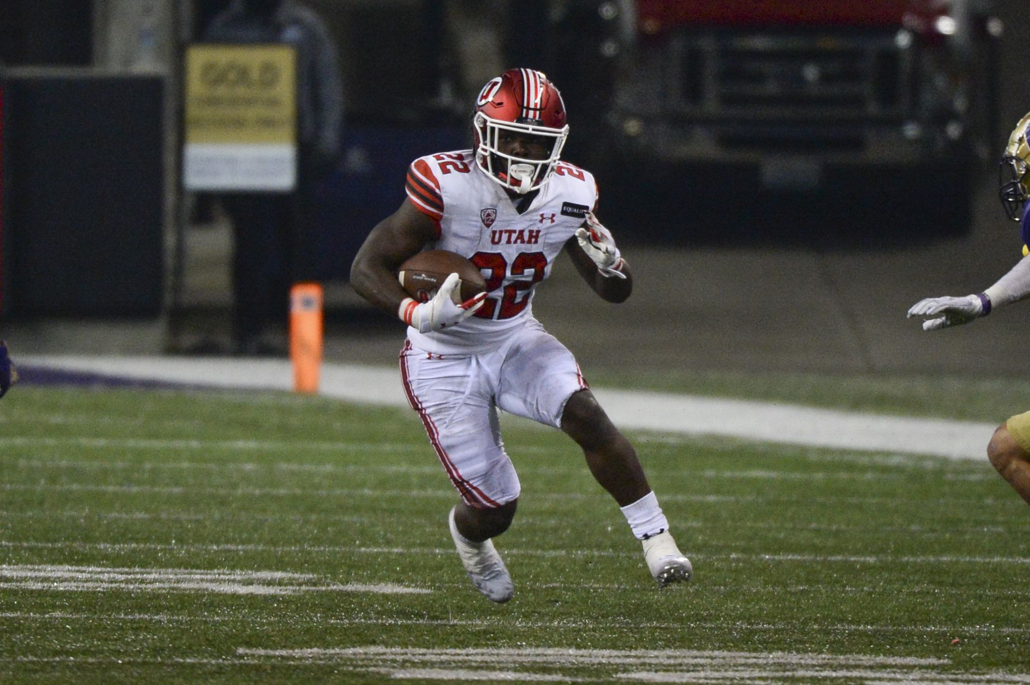SEATTLE, WA - NOVEMBER 28: Utah Utes running back Ty Jordan (22) runs the ball during a PAC12 football game between the Utah Utes and the Washington Huskies on November 28, 2020, at Husky Stadium in Seattle, WA. (Photo by Jeff Halstead/Icon Sportswire)