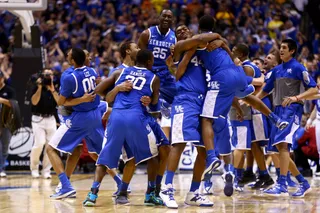 Kentucky's Fab Freshmen Top Michigan - These young Wildcats are fearless. No. 8 Kentucky slipped past second-seeded Michigan 75-72 on Sunday on Aaron Harrison’s game-winning 3-pointer with 2.3 seconds left. They’ll face Wisconsin in the Final Four next.(Photo: Andy Lyons/Getty Images)