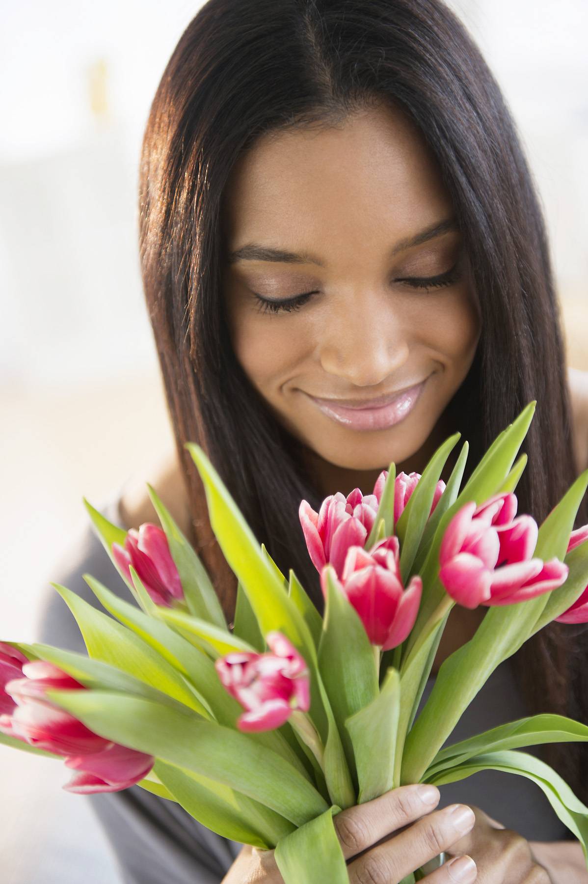 woman smelling flowers