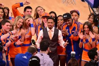 Nick and Knicks - Nick Cannon&nbsp;poses with the Knicks' Dancers after watching the New York Knicks take on the Brooklyn Nets at Madison Square Garden in New York City. (Photo: James Devaney/GC Images)