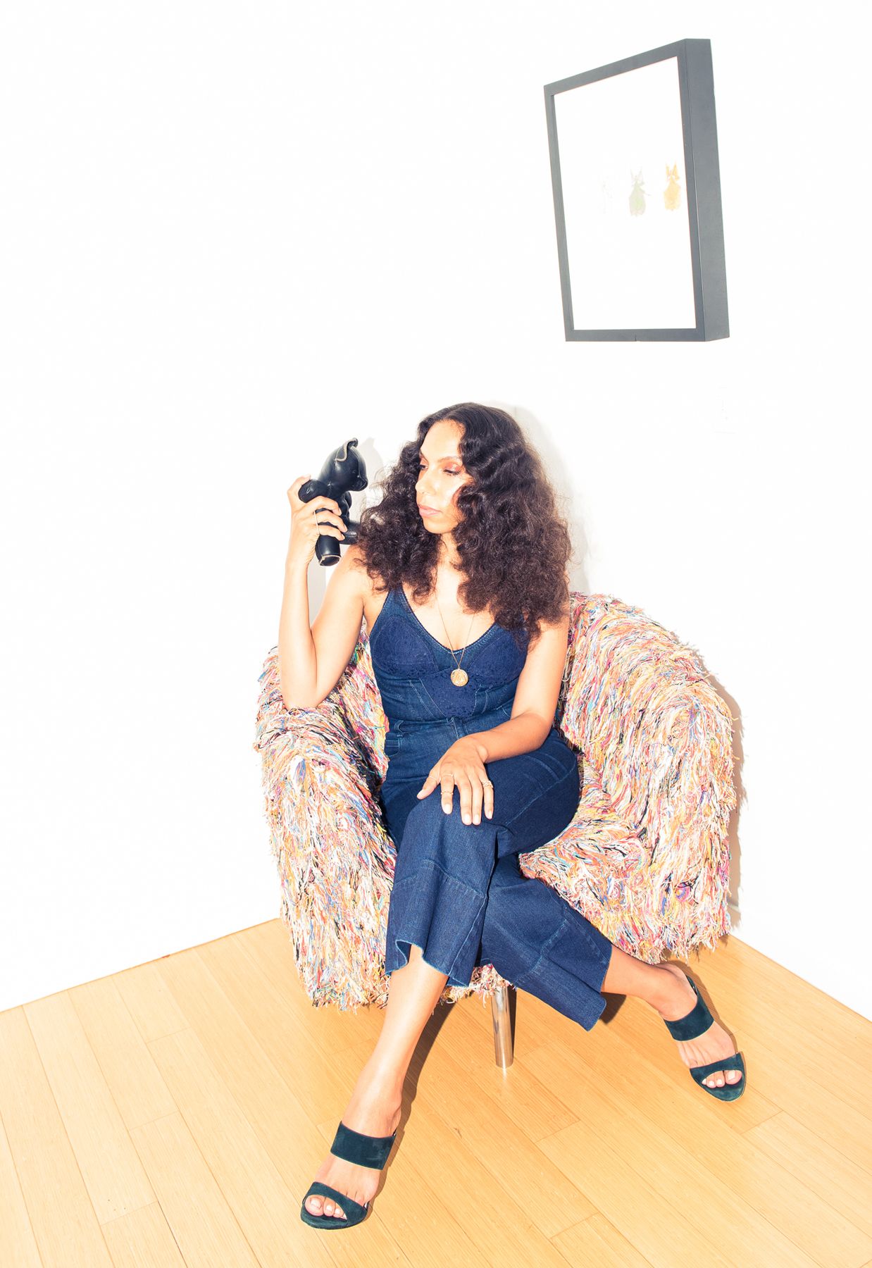 "My latest favorite is a Stella McCartney denim-on-denim outfit that is a denim and blue lace bustier with high-waisted denim flare capris."&nbsp; - (Photo: Jake Rosenberg / The Coveteur)