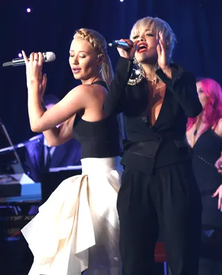 Blonde Ambition - Best Rap Album nominee Iggy Azalea and her "Black Widow" collaborator Rita Ora perform onstage during the Pre-GRAMMY Gala at The Beverly Hilton Hotel.  (Photo: Larry Busacca/Getty Images)
