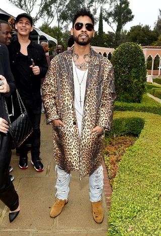 Rock Star Status - Singer Miguel arrives to the Roc Nation and Three Six Zero Pre-GRAMMY Brunch in Beverly Hills wearing a leopard knee-length coat.(Photo: Larry Busacca/Getty Images For Roc Nation)