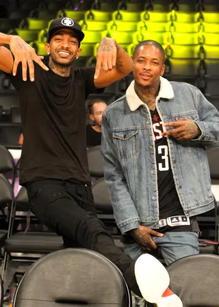 Posin' - Nipsey Hussle and YG posed for the cameras after the Lakers beat the Houston Rockets at the Staples Center. (Photo: Jerry Perez, PacificCoastNews)