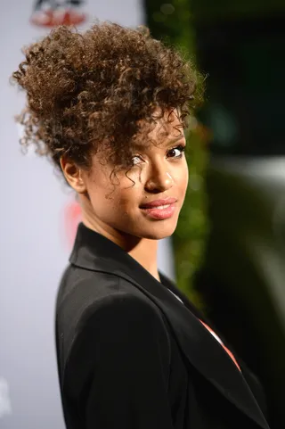 Gugu Mbatha-Raw - The Beyond the Lights actress frequently sports her natural curls to red carpet events. And her overflowing curly bangs are definitely the mane attraction for this look. (Photo: Michael Buckner/Getty Images for Vanity Fair)