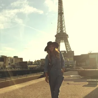 Oh-La-La - Queen B takes in the City of Light in a relaxed denim jumpsuit and a floppy black chapeau. When in Paris...  (Photo: Beyonce via Instagram)