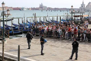 Known Around the World - Throngs of locals filled St. Mark’s Square to get a peek at the Obamas. It's not every day that you have FLOTUS in your backyard.(Photo: Awakening/Getty Images)