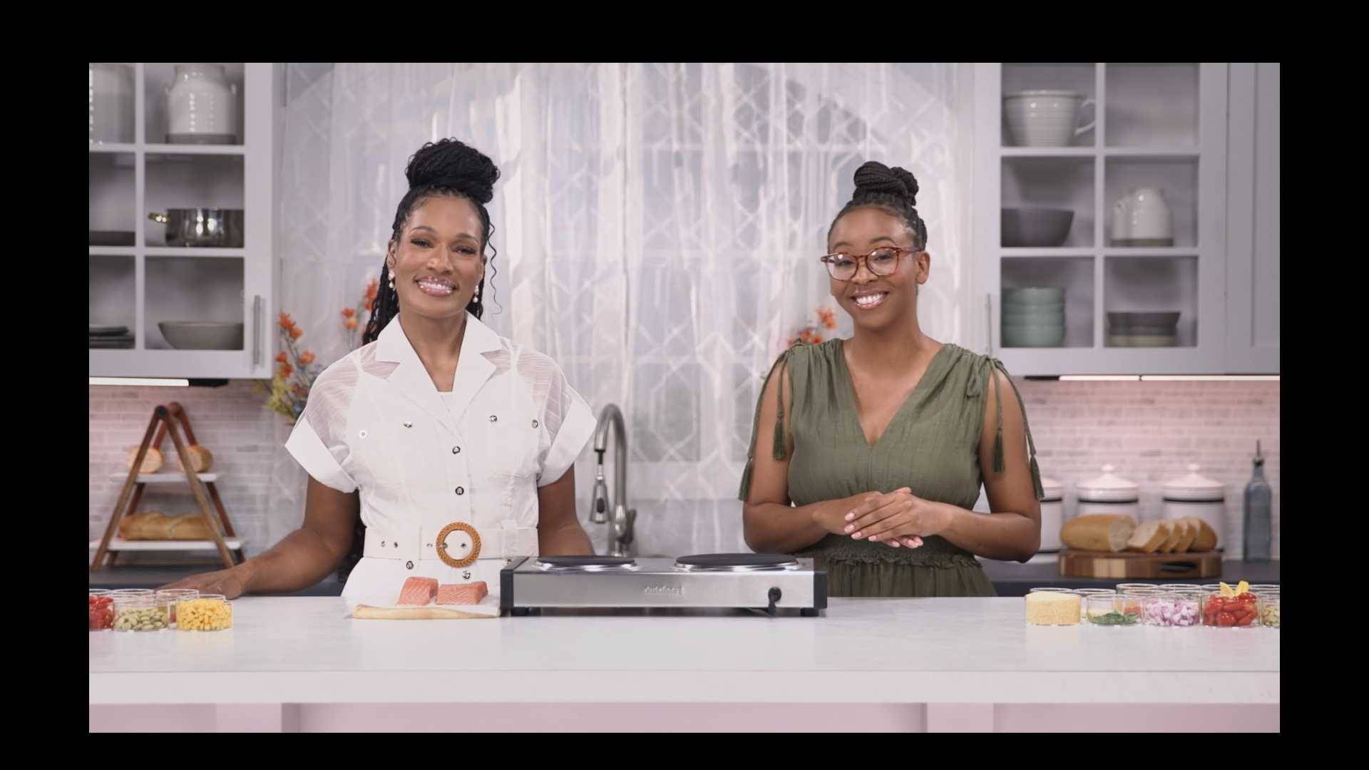 Kron Moore from Tyler Perry's "The Oval" and dietitian Kim Rose cooking