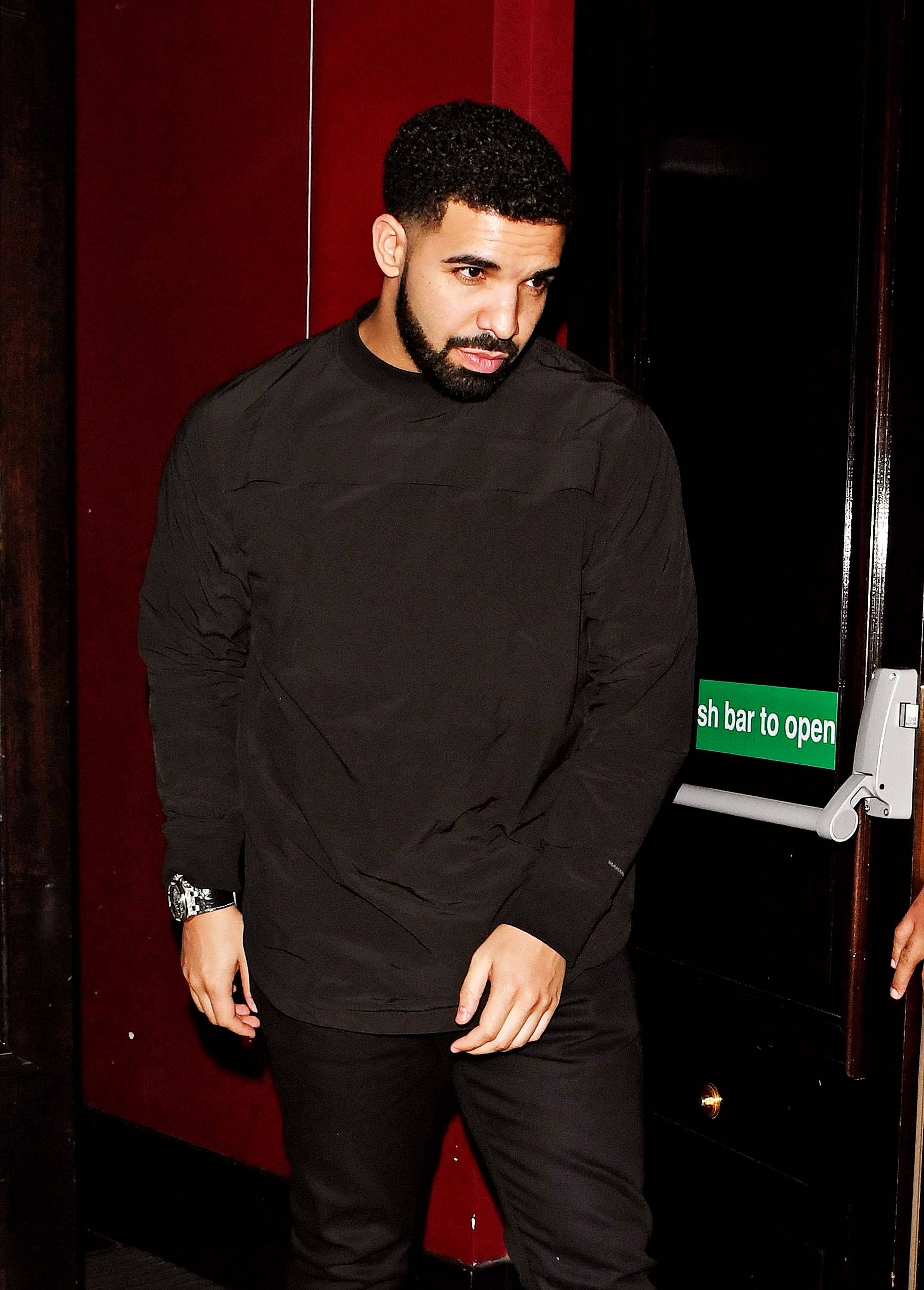 Drake in London - Drake spotted out in London with friends in London's posh Mayfair neighborhood, just 24 hours after Rihanna was in the 'hood. Coincidence?&nbsp;(Photo:&nbsp;Splash News)