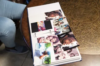 Photos of Markeis McGlockton are displayed in a family photo album. - (Photo: Nathan Bolster/BET)