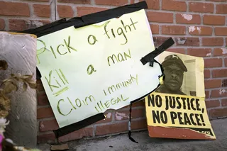 Signs demanding justice for Markeis McGlockton are outside the gas station where he was murdered. - &nbsp;(Photo: Nathan Bolster/BET)