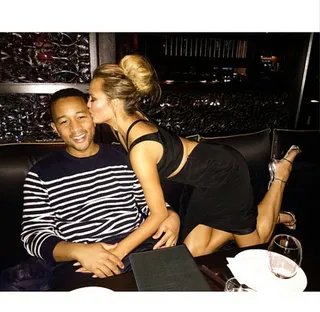 Chrissy Teigen @chrissyteigen - The lovebirds hit up London and get extremely cozy on the couch.  (Photo: Chrissy Teigen via Instagram)