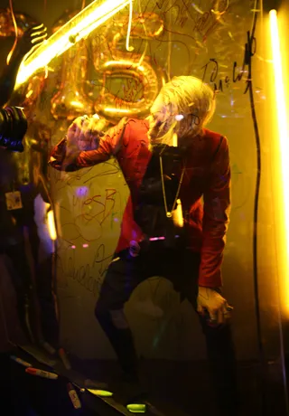 MGK Seals the Deal With a Signature - (Photo: Johnny Nunez / BET)