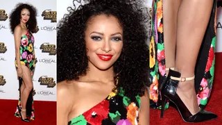 Kat Graham - Kat Graham drops jaws at this year’s awards in a risqué floral high-slit gown exposing a fair share of leg and a whole lot of attitude. The Vampire Diaries star finishes off her look with big hair and a bold lip.&nbsp;(Photos: Bryan Steffy/Getty Images)