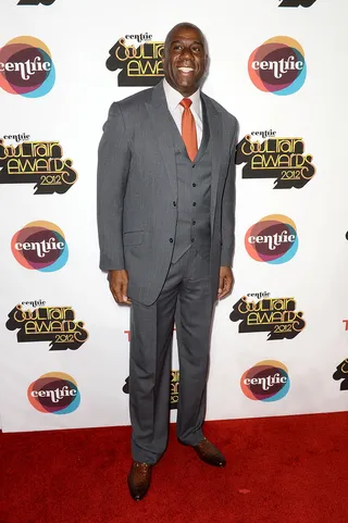 Earvin Magic Johnson - The former NBA star paired his all-gray suit with an orange tie that put his personality on display.  (Photo: Earl Gibson III/Getty Images for Centric)