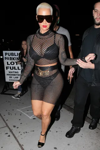 Don't Get Caught in the Net - Amber Rose hosts Mondays at Ace of Diamonds strip club wearing a fishnet two-piece skirt and top ensemble in West Hollywood.(Photo: 3rd Eye/WENN.COM)