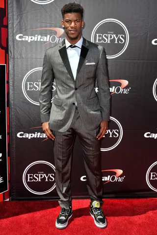 Jimmy Butler - The Chicago Bull paired a sleek gray tuxedo with polka-dotted black lapels with coordinating sneakers.&nbsp;(Photo: Allen Berezovsky/Getty Images)
