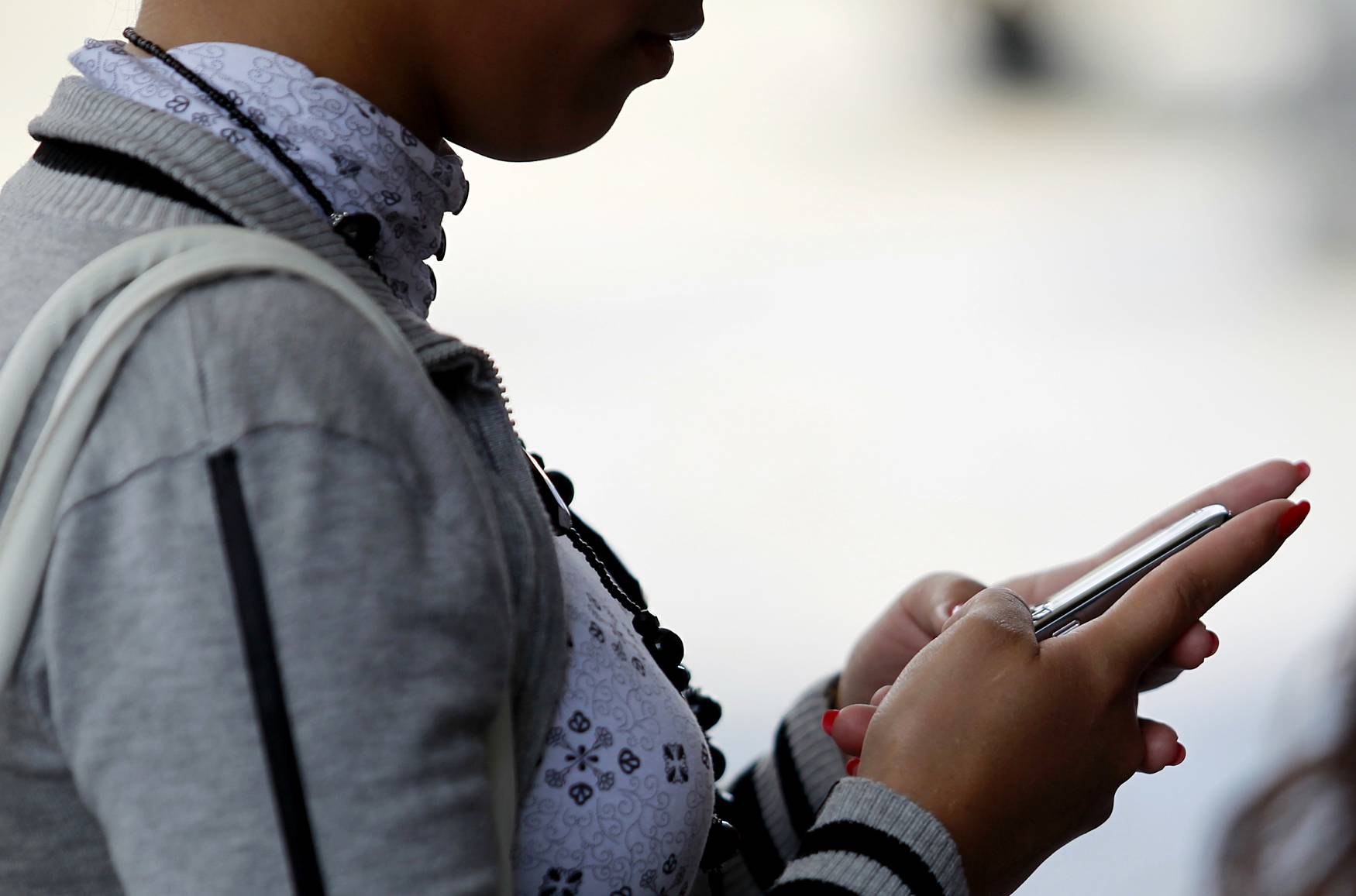 woman on her cell phone texting