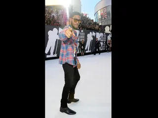 Kid Cudi - Kid Cudi hit the scene in a plaid button-down shirt and black jeans.<br><br><b>(Photo Credit: PictureGroup)</b>
