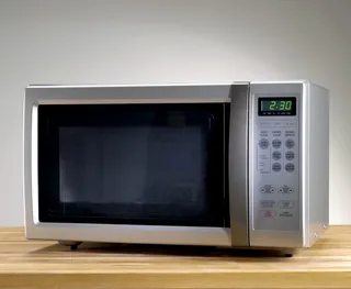 Microwave - Put a bowl of water and vinegar in the microwave and nuke for 10 minutes. The gunk will wipe right out.&nbsp; (Photo: Stocknroll/Getty Images)