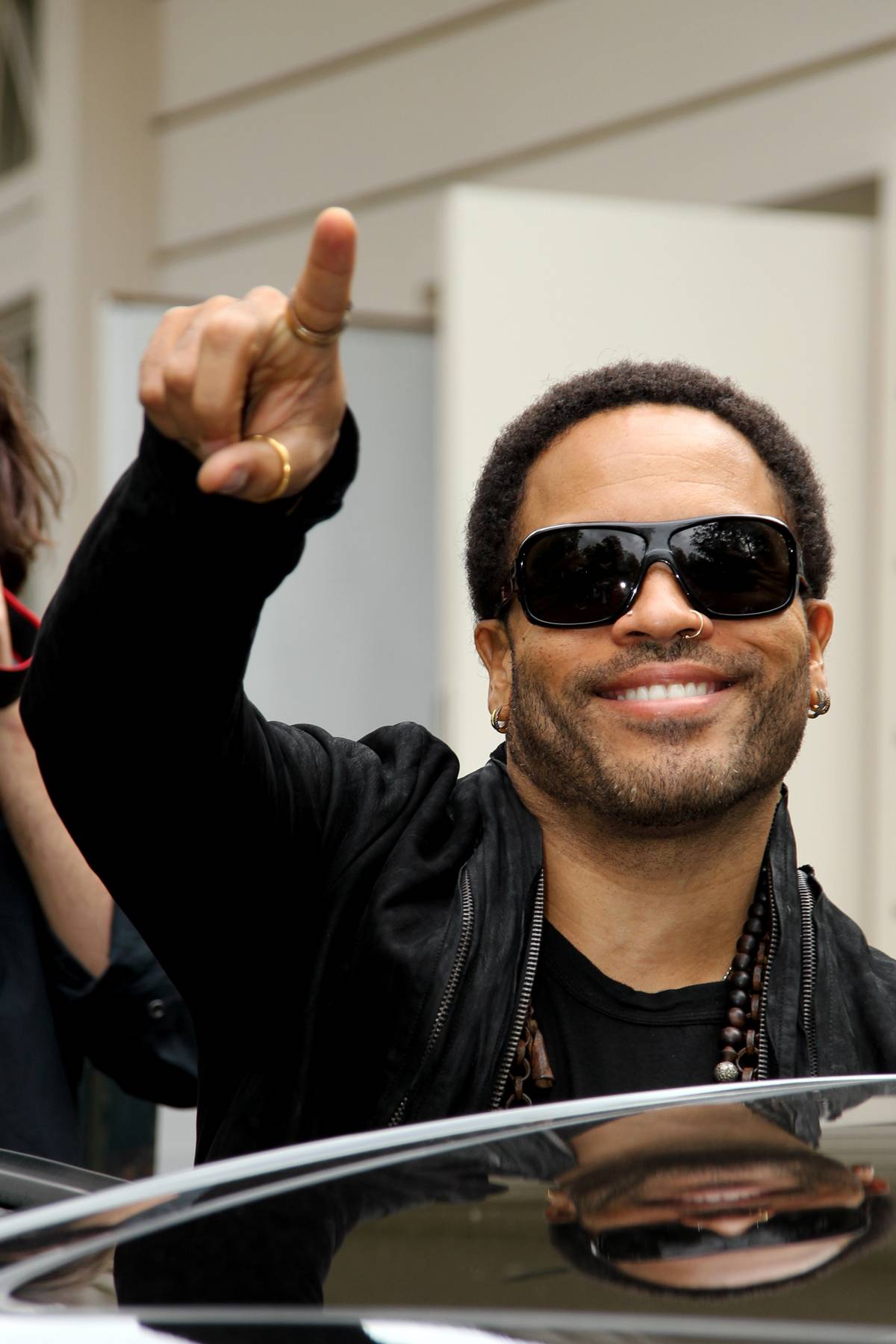 Lenny Does Paris - Rocker Lenny Kravitz smiles and waves at fans as he departs the taping of the French television show Vivement Dimanche in Paris. (Photo: WENN.com)