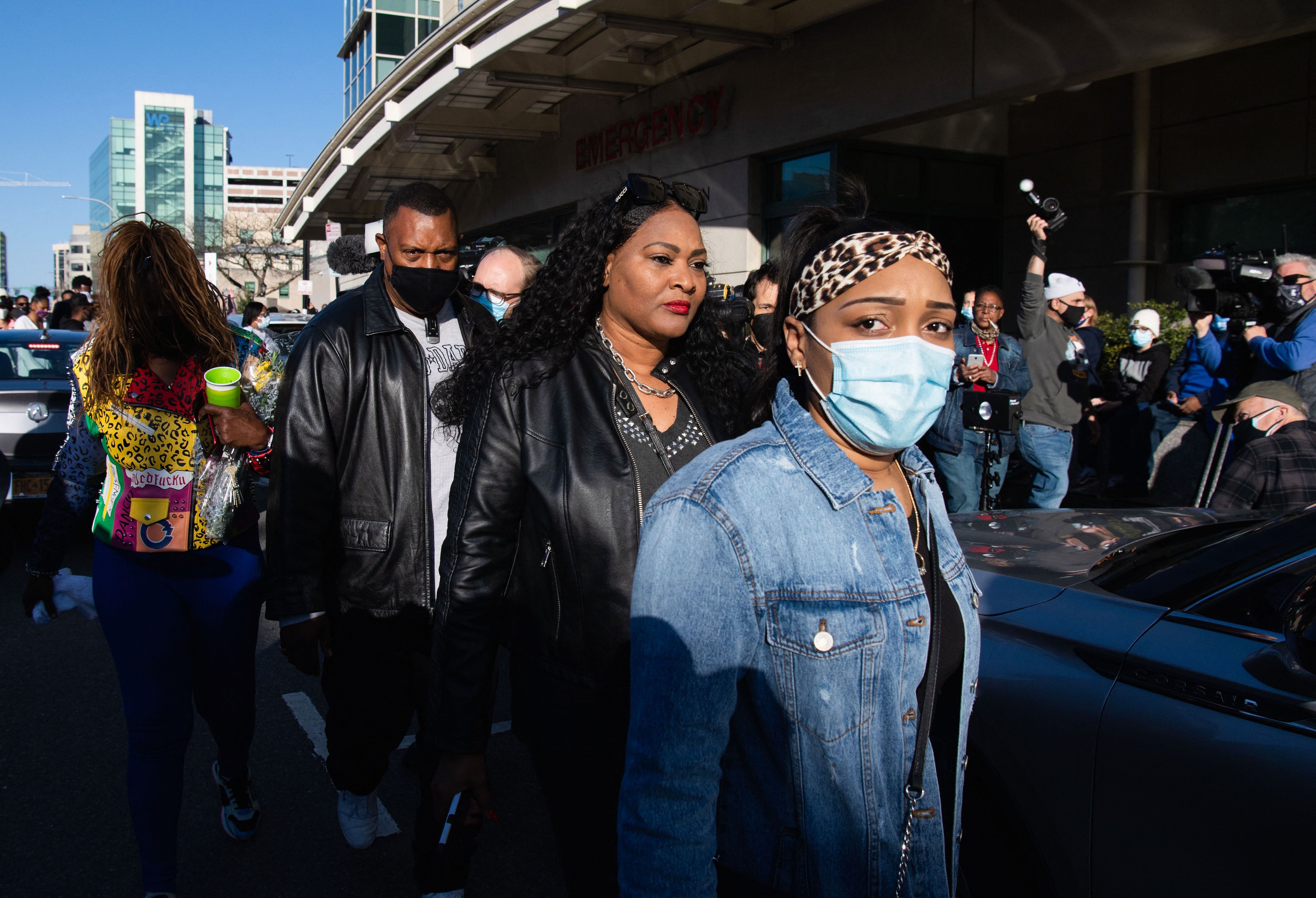 Fiancee Desiree Lindstrom (R) surrounded by family and friends of hospitalized rapper Earl Simmons, aka DMX, attends a prayer vigil hosted by the Ruff Ryders to the Rescue Foundation at White Plains Hospital on April 5, 2021 in White Plains, New York. - Gritty US rapper DMX was hospitalized and on life support on April 3 after a heart attack, his lawyer Murray Richman told AFP. 
"He was hospitalized at 11 o'clock last night at the hospital in White Plains," the New York suburb where he lives, after suffering "a heart attack," Richman, who has represented the rapper for 25 years, told AFP. (Photo by Angela Weiss / AFP) (Photo by ANGELA WEISS/AFP via Getty Images)