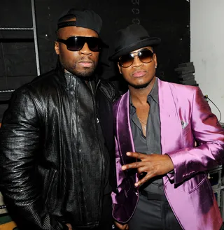 Star Power - Rap mogul 50 Cent and singer-songwriter Ne-Yo look like the modern-day Blues Brothers as they pose for pics backstage at FOX's The X Factor live finale show in Hollywood. (Photo: Frank Micelotta/Fox/PictureGroup)