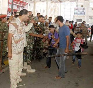 Libyans Return Arms - Reports say hundreds of Libyans have handed in weapons in the Libyan cities of Benghazi and Tripoli in compliance with a disarmament drive aimed at reducing militia groups.&nbsp;(Photo: AP Photo/Ibrahim Alaguri)