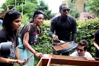 For the Children - Diddy and Dawn Richard of Dirty Money help young volunteers at Toffee Park Adventure Playground And Youth Centre for Orange Rock Corps in London.(Photo: Tim Whitby/Getty Images)