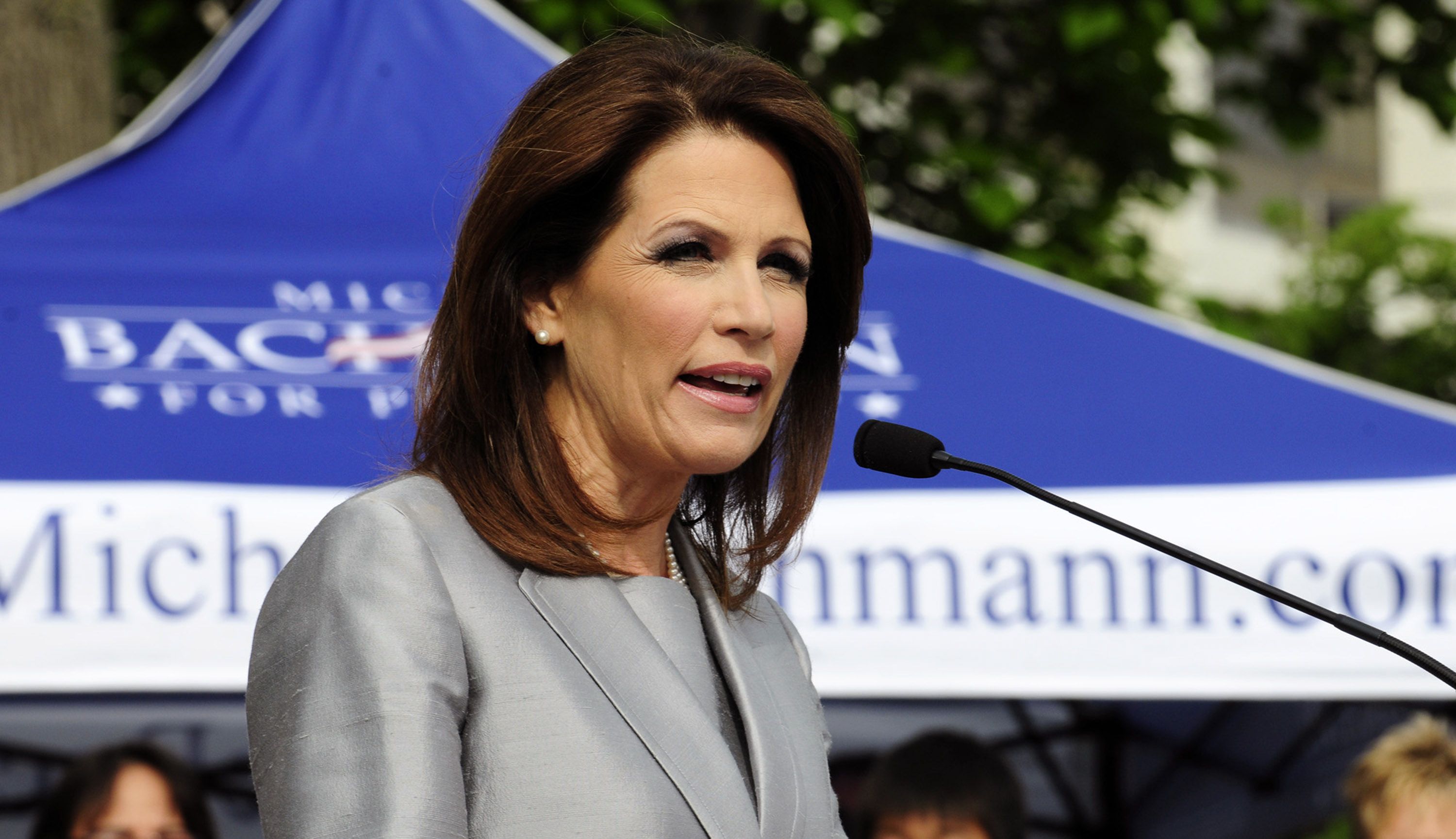 Michele Bachmann - Minnesota Rep. Michele Bachmann, who is poised to win the Ames straw poll in Iowa this weekend, is calling on President Obama to force Treasury Secretary Timothy Geithner to resign, and said during a campaign stop in the state that keeping him is "a tremendous disservice to the American people," ABC News reports. Bachmann also criticized Obama for spending the weekend at Camp David after Standard &amp; Poor’s downgraded the nation’s credit rating.(Photo by Steve Pope/Getty Images)