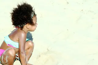 Beach Babe - Surf's up!&nbsp;Blue&nbsp;gets playful in the sand in an adorable two-piece swimsuit and leopard-print bandana.  (Photo: iam.beyonce via Tumblr)