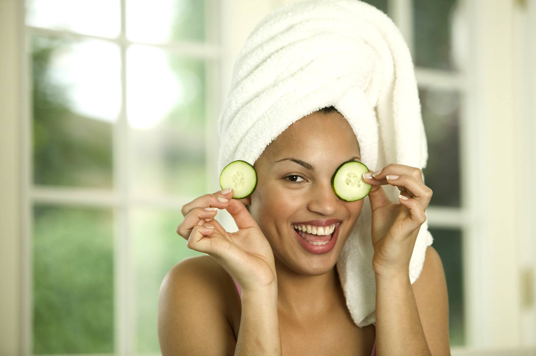 woman giving herself facial at home