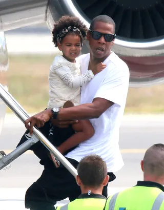 Fly Away With Me - Jay-Z and daughter Blue Ivy catch a flight out of Nice, France, after the family enjoyed a sun-filled vacation aboard a yacht in South France. &nbsp;(Photo: FameFlynet, Inc)