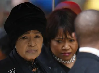 Winne's Pain - Mandela's ex-wife Winnie Mandela and daughter Zindzi arrive for the official service.(Photo: REUTERS/Kai Pfaffenbach)