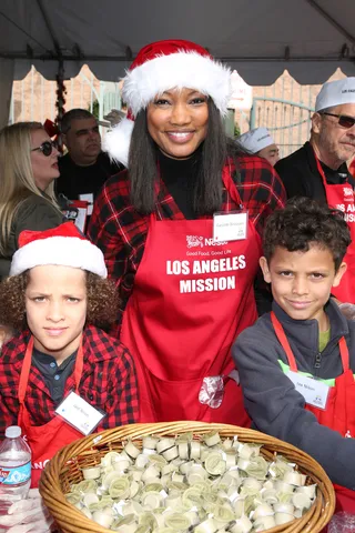 Holiday Cheer - Garcelle Beauvais taught her kids the power of helping others by taking them to the Los Angeles Mission Christmas Meal to the Homeless on Christmas Eve.(Photo: FayesVision/WENN.com)