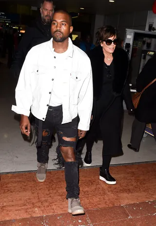 Mother-in-Law Date - Kanye West and Kris Jenner arrived together at Charles de Gaulle airport for Paris fashion week. (Photo: Neil Warner / Splash News)