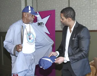 Charity Watch - Esteemed actor Louis Gossett Jr. shows off a T-shirt promoting his Eracism Foundation. (Photo: Maury Phillips/BET Networks)