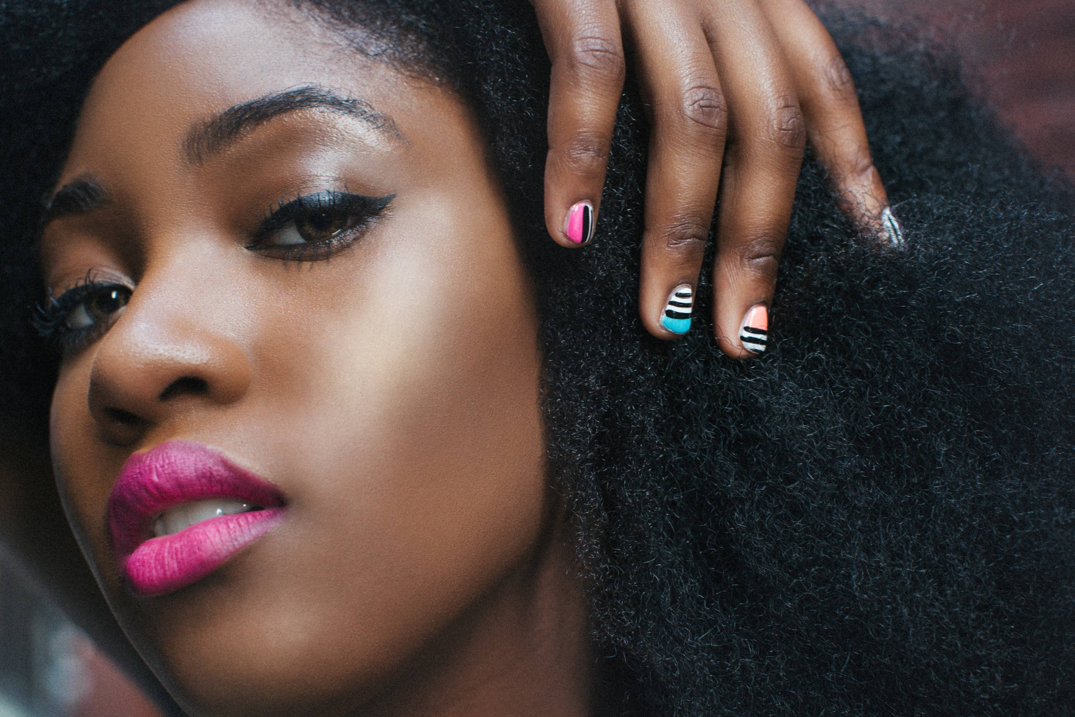 Image of woman wearing pink lipstick.