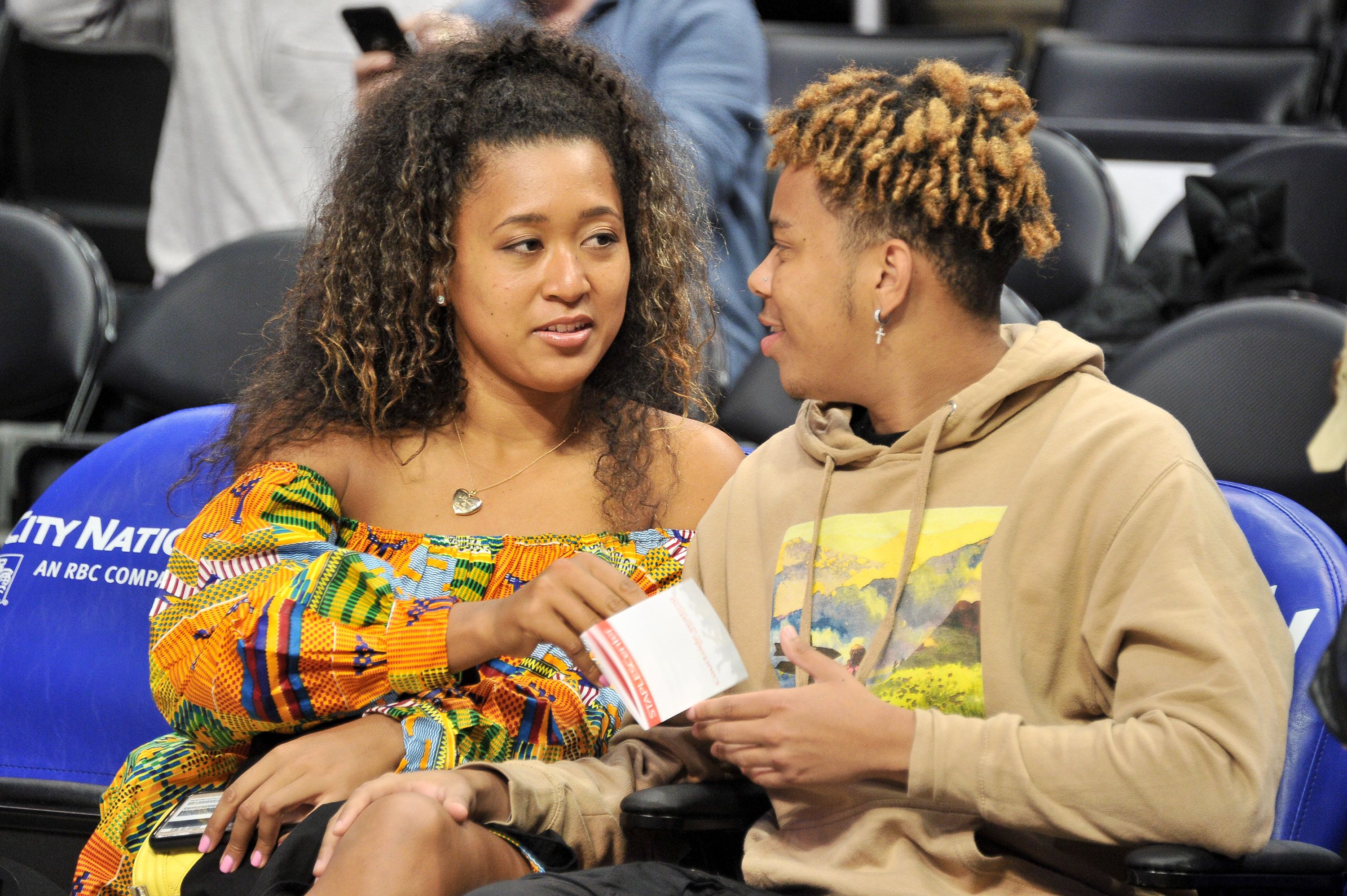 LOS ANGELES, CALIFORNIA - DECEMBER 01: Naomi Osaka and YBN Cordae attend a basketball game between the Los Angeles Clippers and the Washington Wizards at Staples Center on December 01, 2019 in Los Angeles, California. (Photo by Allen Berezovsky/Getty Images)