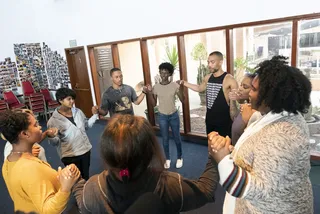 Student activists join hands during a meeting. - (Photo: Lara Solanki/BET)&nbsp;